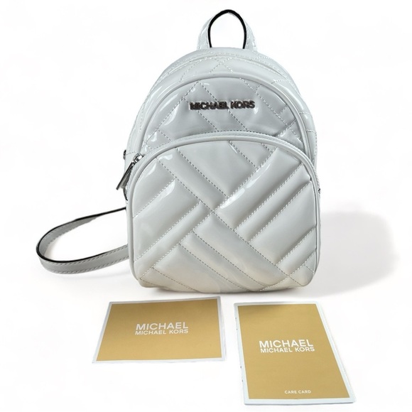 Michael Kors Handbags - MICHAEL KORS Optic White Abbey Mini Leather Backpack Purse Silver Accent New